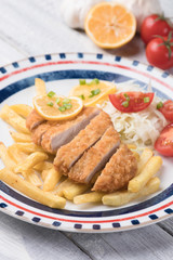 Breaded cutlet with french fries