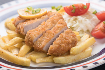 Breaded cutlet with french fries