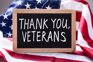 Fototapeta na wymiar Thank You Veterans Text Written On Slate