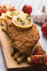 Breaded cutlet with french fries