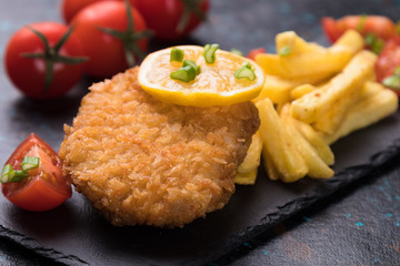 Breaded cutlet with french fries
