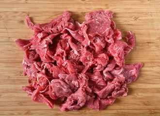 Mound of uncooked shaved beef