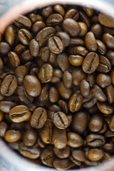 Top view of roasted coffee beans. Vertical photography.