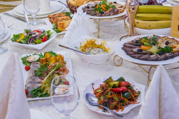 Restaurant table setting, appetizers and fruits