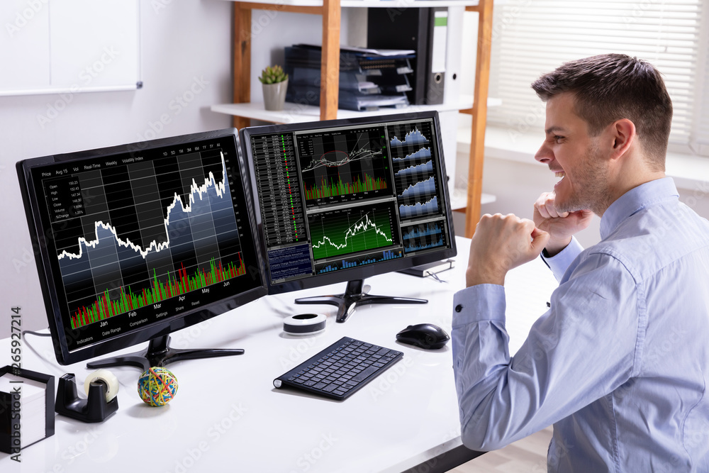 Poster excited stock market broker looking at graph on computer