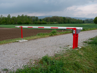 Fototapeta na wymiar Closed Boom Gate or Boom Barrier in the Countryside