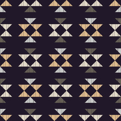 Ethnic boho seamless pattern. Embroidery on fabric. Patchwork texture. Weaving. Traditional ornament. Tribal pattern. Folk motif. Can be used for wallpaper, textile, invitation card, wrapping, web pag