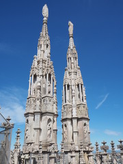 Fototapeta na wymiar Milano, Italy. The spiers of white marble that adorn the entire cathedral. The Duomo is the most famous landmark in Milan