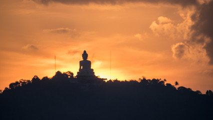 Beautiful Silhouette Sunset Scene of Big Buddha Statue on Hilltop Mountain Famous Viewpoint with Colourful Sky in Phuket - THAILAND
