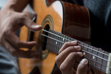 Musician playing ukulele.