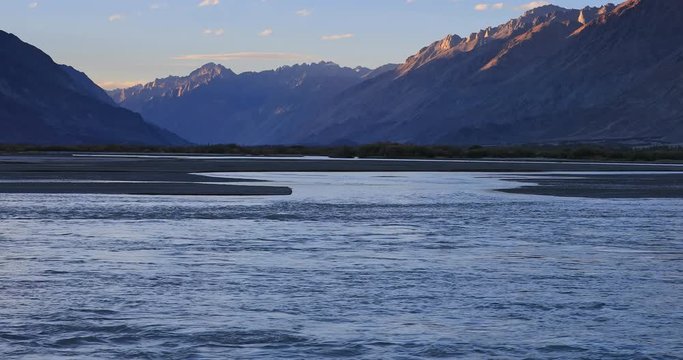 Ladakh India sunset view of Nubra Valley. Shyok river waters flow among high peaks of Himalayan mountains