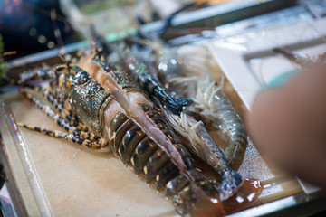 Fresh lobster on a cutting board.
