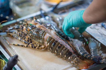 Fresh lobster on a cutting board.