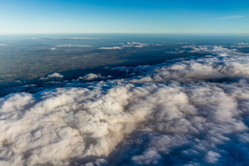 Fototapeta premium Flying above the clouds, view from the airplane, New Zealand