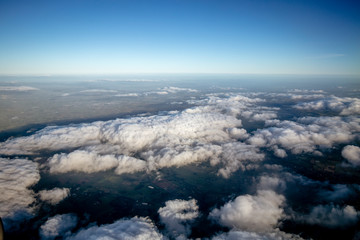 Flying above the clouds, view from the airplane, New Zealand
