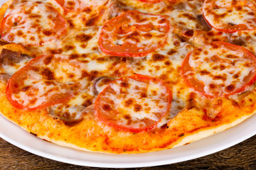Pizza with beef and tomato