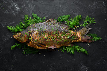 Baked Fish Carp with Vegetables. Top view. Free space for your text. Rustic style.
