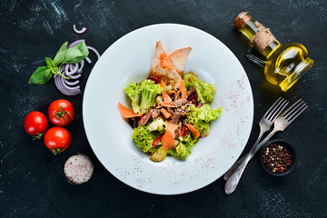 Vegetable salad with veal and mushrooms. In the plate. Top view. Free space for your text. Rustic style.