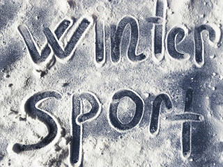 The words winter and sport written on snow. Winter sports concept.