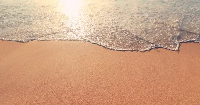 Wet sand beach texture with calm sea wave relaxing nature background