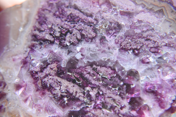 Natural semiprecious purple stone with visible crystal structure