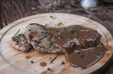 Pepper beef steak with herb and seasoning gravy sauce.