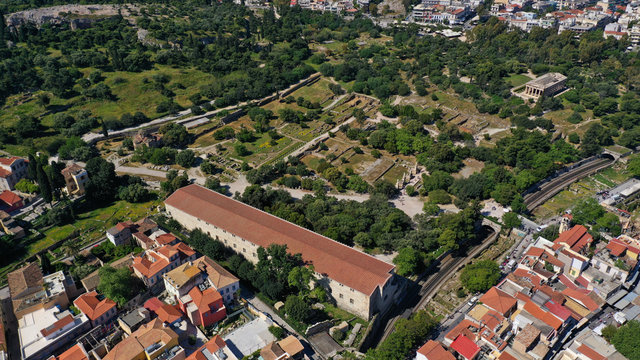 Aerial photo of iconic Ancient Forum a true masterpiece in the heart of ancient Athens featuring Temple of Hephaestus and iconic Stoa of Attalos in the slopes of Acropolis hill, Attica, Greece