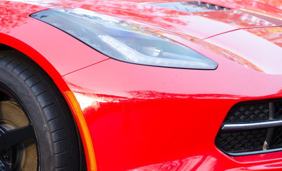 Details of exterior of sport red car at expo