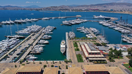 Aerial drone panoramic photo of famous Flisvos Marina with mega yachts and sail boats docked,...