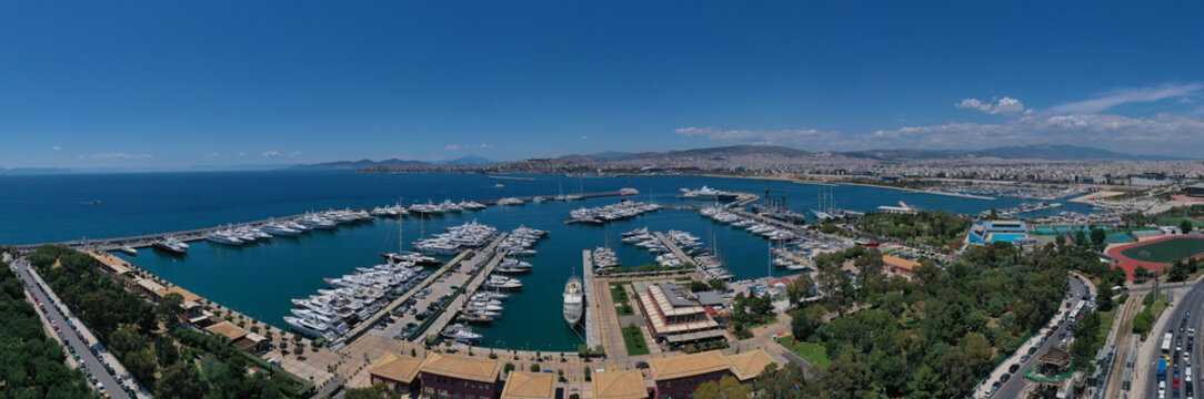 Aerial drone panoramic photo of famous Flisvos Marina with mega yachts and sail boats docked, Athens riviera, Attica, Greece