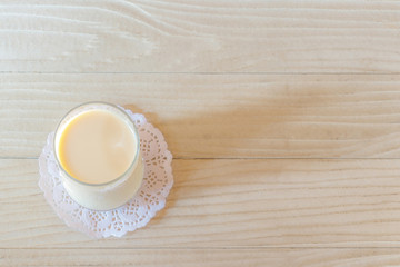 Milk in Glass on Wooden Table