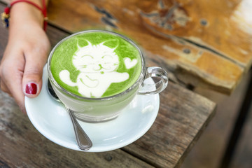 cat cartoon on matcha green tea latte art