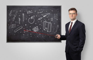 Handsome young teacher with laser pointer teaching 
