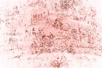 Vintage pink background. Rough painted wall of living coral color. Imperfect plane of beige colored. Uneven old decorative toned backdrop of beige tint. Texture of pink hue. Ornamental stony surface.