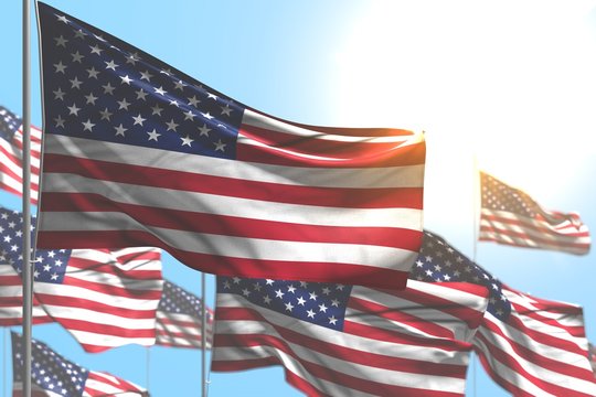 pretty many USA flags are waving against blue sky image with soft focus - any holiday flag 3d illustration..