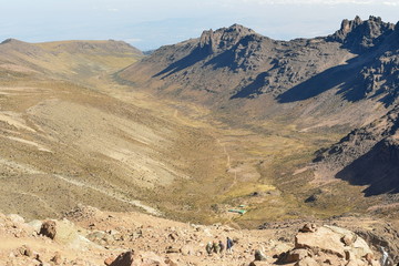 Fototapeta na wymiar Volcanic crater against a mountain background, Mount Kenya, Kenya