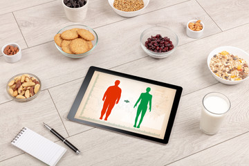 Arrangement of healthy Ingredients with a tablet. Dieting concept