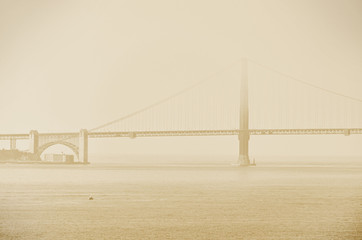 View of Golden Gate Bridge in San Francisco in a foggy morning.