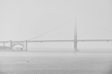 View of Golden Gate Bridge in San Francisco in a foggy morning.