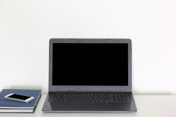 Conceptual workspace, Laptop and phone with blank screen isolated on white background