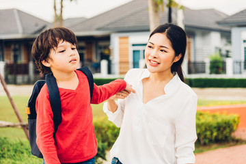 Asian happy mother and child boy playing outdoor