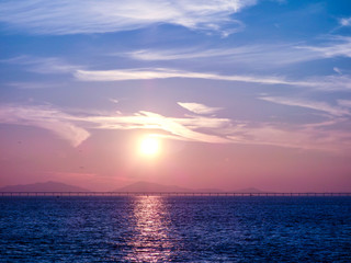 Sea and Bridge at Sunset