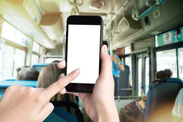 woman hand holding smartphone on city metro bus in morning blur background  with clipping path