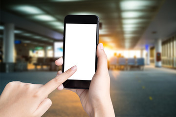 woman hand holding smartphone on airport terminal blur background  with clipping path