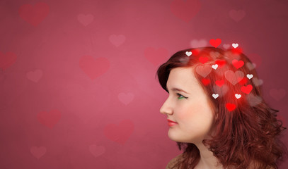 Head with full of love, red background and hearts 
