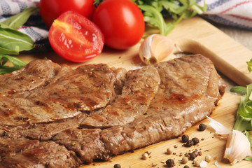 A beef steak well done with vegetables