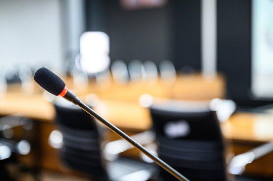 Microphone over the blurred business forum Meeting or Conference Training Learning Coaching Room Concept, Blurred background.