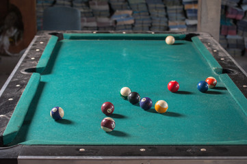 Billiards balls and cue on billiards table. Billiard sport concept