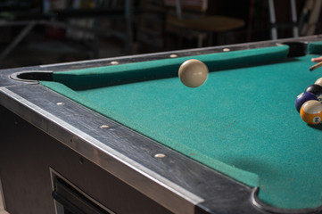 Billiards balls and cue on billiards table. Billiard sport concept