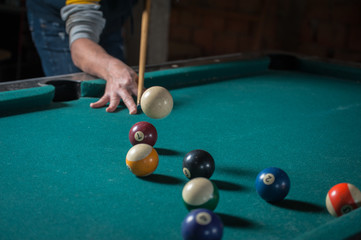 Billiards balls and cue on billiards table. Billiard sport concept